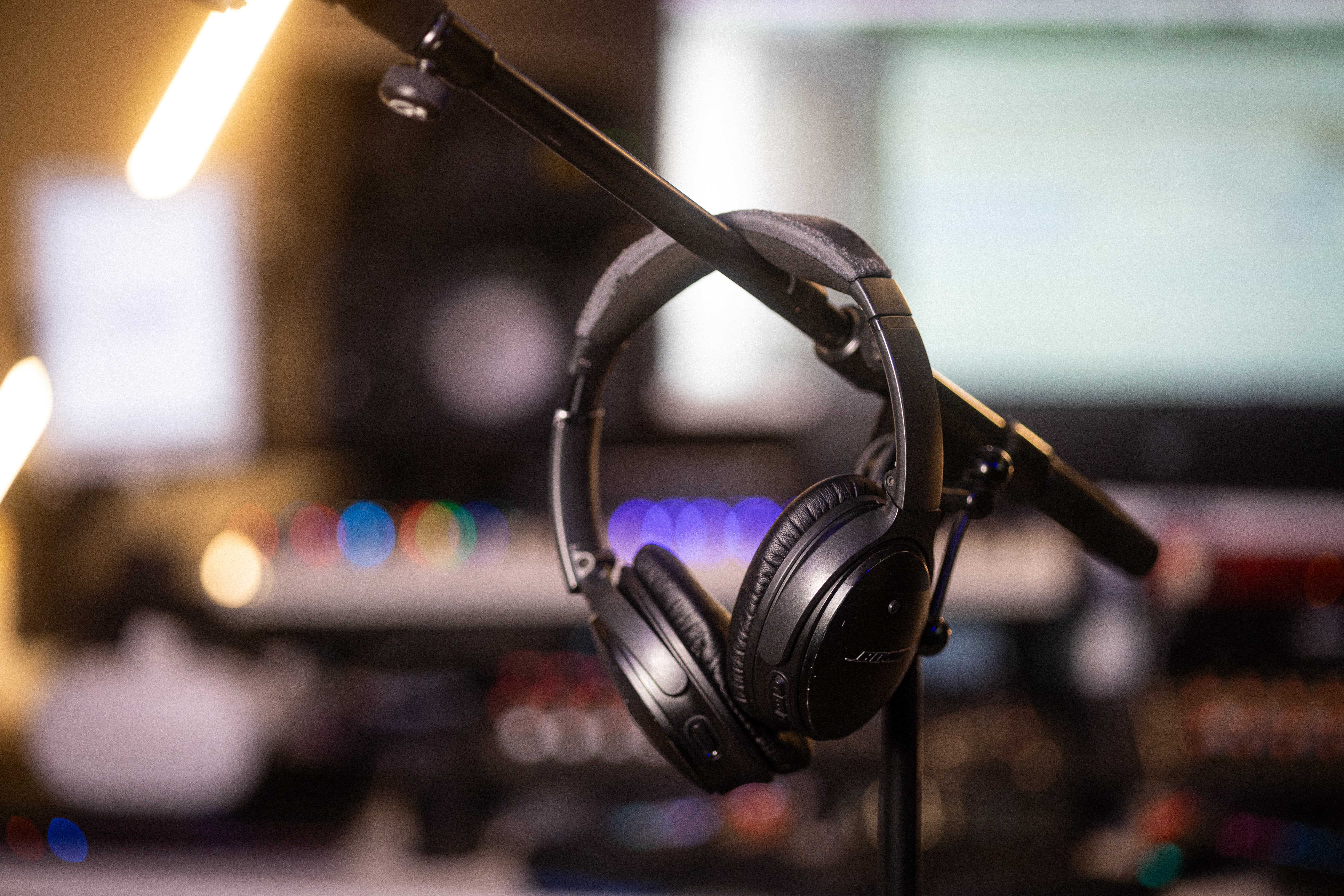3d audio agency equipment of headphones hanging on a microphone